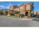 Charming two-story townhome featuring a landscaped yard and a well-maintained front exterior at 11420 Ogden Mills Dr # 101, Las Vegas, NV 89135