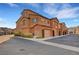 Beautiful multi-story townhome with desert landscaping and charming architectural details in a well-maintained community at 11420 Ogden Mills Dr # 101, Las Vegas, NV 89135