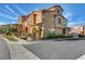 Corner lot featuring a two-story home with a landscaped area and a detached garage at 11420 Ogden Mills Dr # 101, Las Vegas, NV 89135