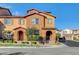 Two-story residence with multiple entryways and a well-manicured landscaped area at 11420 Ogden Mills Dr # 101, Las Vegas, NV 89135