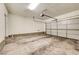 Spacious two-car garage with ample room for parking and storage, featuring a clean, concrete floor at 11420 Ogden Mills Dr # 101, Las Vegas, NV 89135