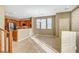 Kitchen with stainless steel appliances, granite countertops, and a breakfast bar open to the living area at 11420 Ogden Mills Dr # 101, Las Vegas, NV 89135