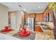 Modern kitchen with stainless steel appliances and granite countertops overlooks a dining area at 11420 Ogden Mills Dr # 101, Las Vegas, NV 89135