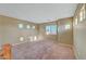 Spacious loft with carpet flooring and multiple windows, offering plenty of natural light at 11420 Ogden Mills Dr # 101, Las Vegas, NV 89135
