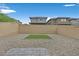 Low maintenance backyard with gravel and a patch of artificial turf at 117 Destiny Orchard Ct, Henderson, NV 89011