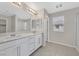 Elegant bathroom featuring double vanity with white cabinets, and tile flooring at 117 Destiny Orchard Ct, Henderson, NV 89011