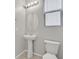 Modern bathroom features a pedestal sink and sleek fixtures at 117 Destiny Orchard Ct, Henderson, NV 89011