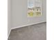 Bright bedroom with neutral carpet and window view at 117 Destiny Orchard Ct, Henderson, NV 89011