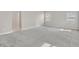 Bright, carpeted bedroom featuring natural light and a view to a shared hallway at 117 Destiny Orchard Ct, Henderson, NV 89011