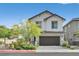 Charming two-story home featuring a two-car garage, lovely landscaping, and a welcoming facade at 117 Destiny Orchard Ct, Henderson, NV 89011
