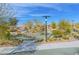 Community play area with playground equipment, picnic tables and mature landscaping at 117 Destiny Orchard Ct, Henderson, NV 89011