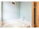 Clean bathroom featuring a soaking tub with tile surround and access to shower room at 1220 Basin Brook Dr, North Las Vegas, NV 89032