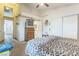 Bedroom featuring a ceiling fan, closet space, and access to the ensuite bathroom at 1220 Basin Brook Dr, North Las Vegas, NV 89032