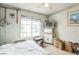 Bedroom with natural light, ceiling fan and vintage TV cabinet at 1220 Basin Brook Dr, North Las Vegas, NV 89032
