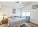 Bedroom featuring a ceiling fan, closet space and window seat at 1220 Basin Brook Dr, North Las Vegas, NV 89032