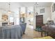 Bright living room with a fireplace, ceiling fan, and easy access to the kitchen and other living spaces at 1220 Basin Brook Dr, North Las Vegas, NV 89032