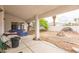 Covered patio with concrete flooring overlooking a spacious yard at 1220 Basin Brook Dr, North Las Vegas, NV 89032
