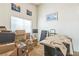 A cluttered spare room with boxes and a covered piano at 1220 Basin Brook Dr, North Las Vegas, NV 89032