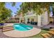The backyard features a pristine pool with steps and a covered patio, ideal for outdoor gatherings at 1246 E Gary Ave, Las Vegas, NV 89123