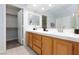 Bathroom features dual sinks, tile flooring, and access to a walk-in closet at 1246 E Gary Ave, Las Vegas, NV 89123