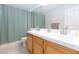 Bathroom featuring double sinks, a tiled countertop, and a shower with a curtain at 1246 E Gary Ave, Las Vegas, NV 89123