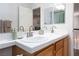 Spacious bathroom with double vanity, bright mirrors, and modern fixtures at 1246 E Gary Ave, Las Vegas, NV 89123