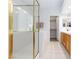 Bright bathroom with a glass enclosed shower, bathtub, and tile flooring at 1246 E Gary Ave, Las Vegas, NV 89123