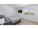 Cozy bedroom features a large window, wood floors, and mounted television at 1246 E Gary Ave, Las Vegas, NV 89123
