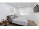 Well-lit bedroom with stylish furniture, soft carpet, and a serene atmosphere at 1246 E Gary Ave, Las Vegas, NV 89123