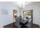 Formal dining room featuring stylish furnishings, elegant lighting, and a view of the backyard at 1246 E Gary Ave, Las Vegas, NV 89123