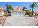 Charming two-story home featuring a three-car garage and low-maintenance landscaping in the front yard at 1246 E Gary Ave, Las Vegas, NV 89123