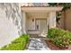 Inviting front entrance featuring a decorative door, manicured landscaping, and a walkway at 1246 E Gary Ave, Las Vegas, NV 89123