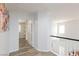 Upper hallway with neutral walls and trim, featuring wood-look floors at 1246 E Gary Ave, Las Vegas, NV 89123