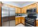 Well-equipped kitchen with stainless steel appliances and light wood cabinetry at 1246 E Gary Ave, Las Vegas, NV 89123