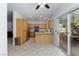 Bright kitchen featuring wood cabinets, stainless steel appliances, and patio access at 1246 E Gary Ave, Las Vegas, NV 89123