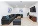 Spacious living room featuring comfortable seating, a flat-screen TV, and neutral decor at 1246 E Gary Ave, Las Vegas, NV 89123