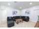 Spacious living room with a stylish sectional sofa and contemporary artwork at 1246 E Gary Ave, Las Vegas, NV 89123