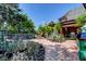 Spacious backyard with brick paving and an array of cactus and desert landscaping under blue skies at 1700 Red Rock St, Las Vegas, NV 89146