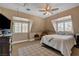 Bright bedroom featuring a bed, carpet flooring, and abundant natural light from the windows at 1700 Red Rock St, Las Vegas, NV 89146