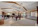 Large game room featuring a pool table, piano, and an entertainment area, ideal for social gatherings at 1700 Red Rock St, Las Vegas, NV 89146