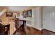 Hallway with wood floors, decorative art, a chandelier, and bright cabinets for style and elegance at 1700 Red Rock St, Las Vegas, NV 89146