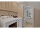 Convenient laundry room with modern washer and dryer hookups and cabinetry for storage at 1700 Red Rock St, Las Vegas, NV 89146