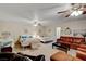 Spacious living room featuring multiple beds, ceiling fans, and comfortable seating arrangements at 1700 Red Rock St, Las Vegas, NV 89146