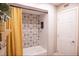 Bathroom featuring decorative tile work around the shower-tub at 2043 Sombrero Dr, Las Vegas, NV 89169