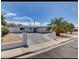 A modern exterior featuring a driveway and desert landscaping at 2043 Sombrero Dr, Las Vegas, NV 89169