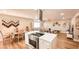 Modern open floorplan kitchen view with stainless vent hood, dining table, and living room at 2043 Sombrero Dr, Las Vegas, NV 89169