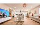 Spacious, open floor plan connecting living, dining, and kitchen with hardwood floors at 2043 Sombrero Dr, Las Vegas, NV 89169