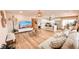 Inviting living space features wood floors, natural light, and an open concept to the kitchen at 2043 Sombrero Dr, Las Vegas, NV 89169