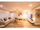 Comfortable living room with wood floors, ample seating, natural light and neutral decor at 2043 Sombrero Dr, Las Vegas, NV 89169