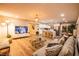 Bright, open-concept living room with wood floors, modern furnishings and eat-in kitchen with island at 2043 Sombrero Dr, Las Vegas, NV 89169
